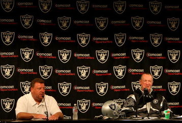 ALAMEDA, CA - SEPTEMBER 30: Oakland Raiders owner Al Davis and Tom Cable speak during a press conference after being named new head coach after the firing of Lane Kiffin of the Oakland Raiders at thier training facility on Septemer 30, 2008 in Alameda, California.  (Photo by Jed Jacobsohn/Getty Images)