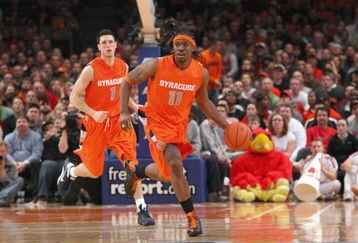 NEW YORK - MARCH 14:  Paul Harris #11 of the Syracuse Orange dribbles the ball downcourt against the Louisville Cardinals during the championship game of the Big East Tournament at Madison Square Garden on March 14, 2009 in New York City.  (Photo by Jim McIsaac/Getty Images)
