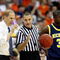 KANSAS CITY, MO - MARCH 19:  NCAA Referee Kelly Self speaks to Head Coach John Beilein of the Michigan Wolverines during the first round of the NCAA Division I Men's Basketball Tournament between the Michigan Wolverines and the Clemson Tigers at the Sprint Center on March 19, 2009 in Kansas City, Missouri. The Wolverines defeated the Tigers 62-59. (Photo by Jamie Squire/Getty Images)