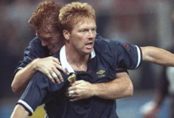 16 Jun 1990:  Mo Johnstone (front) and Alex McLeish (behind) of Scotland celebrate their win during the World Cup match against Sweden in Genoa, Italy. Scotland won the match 2-1. \ Mandatory Credit: Simon  Bruty/Allsport