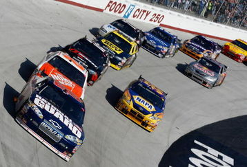 BRISTOL, TN - MARCH 22:  Dale Earnhardt Jr., driver of the #88 National Guard/AMP Energy Chevrolet, leads a pack of cars into turn one during the NASCAR Sprint Cup Series Food City 500 at Bristol Motor Speedway on March 22, 2009 in Bristol, Tennessee.  (Photo by Geoff Burke/Getty Images for NASCAR)