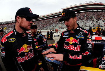 BRISTOL, TN - MARCH 21:  Scott Speed (R), driver of the #99 Red Bull Toyota, talks with Cup teammate Brian Vickers, driver of the #83 Red Bull Toyota, on the grid prior to the start of the NASCAR Nationwide Series Scotts Turf Builder 300 at Bristol Motor Speedway on March 21, 2009 in Bristol, Tennessee.  (Photo by Rusty Jarrett/Getty Images for NASCAR)