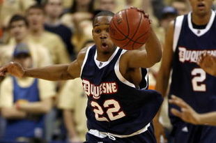 PITTSBURGH - DECEMBER 06:  Gary Tucker #22 of the Duquesne Dukes tries to gain control of the ball during a game against the Pittsburgh Panthers on December 6, 2006 at the Petersen Events Center in Pittsburgh, Pennsylvania. Pittsburgh defeated Duquesne, 73-56.  (Photo by Gregory Shamus/Getty Images)