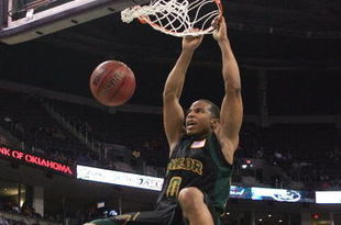 OKLAHOMA CITY - MARCH 08: Curtis Jerrelis #0 of the Baylor Bears dunks as Darryl Butterfield #35 lof the Missouri Tigers looks on during the first round of the Phillips 66 Big 12 Men's Basketball Championship on March 8, 2007 at the Ford Center in Oklahoma City, Oklahoma. (Photo by Jamie Squire/Getty Images)