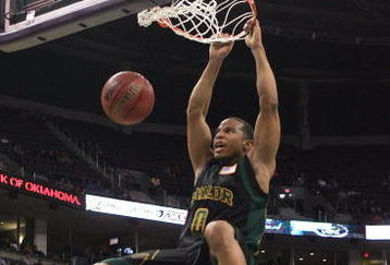 OKLAHOMA CITY - MARCH 08:  Curtis Jerrelis #0 of the Baylor Bears dunks as Darryl Butterfield #35 lof the Missouri Tigers looks on during the first round of the Phillips 66 Big 12 Men's Basketball Championship on March 8, 2007 at the Ford Center in Oklahoma City, Oklahoma.  (Photo by Jamie Squire/Getty Images)