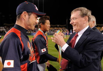 LOS ANGELES, CA - MARCH 23:  Ichiro Suzuki #51 of Japan is awarded the World Baseball Classic medal by MLB Commissioner Bud Selig after defeating Korea 5-3 in the finals of the 2009 World Baseball Classic on March 23, 2009 at Dodger Stadium in Los Angeles, California.  (Photo by Mark J. Terrill-Pool/Getty Images)