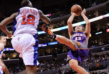 LOS ANGELES, CA - FEBRUARY 18:  Steve Nash #13 of the Phoenix Suns throws up a shot as he falls backwards against Al Thornton #12 of the Los Angeles Clippers during the first quarter at the Staples Center February 18, 2009, in Los Angeles, California. NOTE TO USER: User expressly acknowledges and agrees that, by downloading and or using this photograph, User is consenting to the terms and conditions of the Getty Images License Agreement. (Photo by Kevork Djansezian/Getty Images)