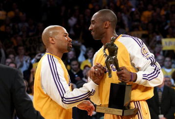 LOS ANGELES, CA - MAY 07:  Derek Fisher #2 congratulates teammate Kobe Bryant #24 of the Los Angeles Lakers after Bryant was presented with the MVP trophy before Game Two of the Western Conference Semifinals against the Utah Jazz during the 2008 NBA Playoffs on May 7, 2008 at Staples Center in Los Angeles, California.  NOTE TO USER: User expressly acknowledges and agrees that, by downloading and/or using this Photograph, user is consenting to the terms and conditions of the Getty Images License Agreement.  (Photo by Stephen Dunn/Getty Images)*** Local Caption *** Derek Fisher;Kobe Bryant
