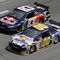 DAYTONA BEACH, FL - FEBRUARY 11:  David Reutimann driver of the #00 Aaron's Dream Machine Toyota races with Brian Vickers driver of the #83 Red Bull Toyota during practice for the NASCAR Sprint Cup Series Daytona 500 at Daytona International Speedway on February 11, 2009 in Daytona Beach, Florida.  (Photo by John Harrelson/Getty Images for NASCAR)