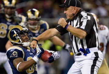 ST. LOUIS, MO - DECEMBER 21: Kenneth Darby #33 of the St. Louis Rams runs into umpire Garth DeFelice #53 against the San Francisco 49ers at the Edward Jones Dome on December 21, 2008 in St. Louis, Missouri.  The 49ers beat the Rams 17-16.  (Photo by Dilip Vishwanat/Getty Images)