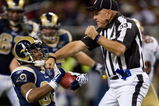 ST. LOUIS, MO - DECEMBER 21: Kenneth Darby #33 of the St. Louis Rams runs into umpire Garth DeFelice #53 against the San Francisco 49ers at the Edward Jones Dome on December 21, 2008 in St. Louis, Missouri.  The 49ers beat the Rams 17-16.  (Photo by Dilip Vishwanat/Getty Images)