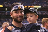 ST PETERSBURG, FL - OCTOBER 19:  Dan Wheeler #35 celebrates with his son after defeating the Boston Red Sox in game seven of the American League Championship Series during the 2008 MLB playoffs on October 19, 2008 at Tropicana Field in St Petersburg, Florida.  The Rays defeated the Red Sox 3-1 to win the series 4-3.  (Photo by Doug Pensinger/Getty Images)