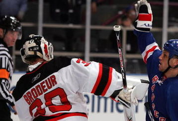 NEW YORK - APRIL 13: Sean Avery #16 of the New York Rangers tries to screen Martin Brodeur #30 of the New Jersey Devils during game three of the 2008 NHL Eastern Conference Quarterfinals on April 13, 2008 at Madison Square Garden in New York City.  (Photo by Jim McIsaac/Getty Images)