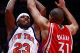 NEW YORK - JANUARY 26:  Quentin Richardson #23 of the New York Knicks shoots over Shane Battier #31 of the Houston Rockets at Madison Square Garden January 26, 2009 in New York City. NOTE TO USER: User expressly acknowledges and agrees that, by downloading and/or using this Photograph, User is consenting to the terms and conditions of the Getty Images License Agreement.  (Photo by Chris McGrath/Getty Images)