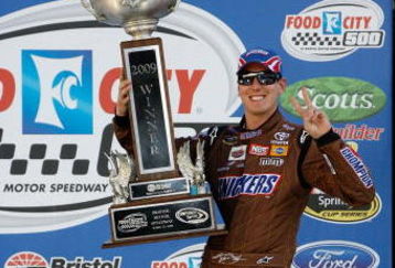 BRISTOL, TN - MARCH 22:  Kyle Busch, driver of the #18 Snickers Toyota, poses in victory lane after winning the NASCAR Sprint Cup Series Food City 500 at Bristol Motor Speedway on March 22, 2009 in Bristol, Tennessee.  (Photo by Geoff Burke/Getty Images for NASCAR)