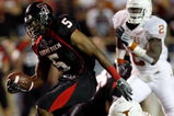 LUBBOCK, TX - NOVEMBER 01:  Michael Crabtree #5 of the Texas Tech Red Raiders carries the ball after making a reception during the first half of the game against the Texas Longhorns on November 1, 2008 at Jones Stadium in Lubbock, Texas.  (Photo by Jamie Squire/Getty Images)