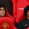 MANCHESTER, UNITED KINGDOM - AUGUST 06:  Rafael Da Silva (L) sits on the bench beside his twin brother and team mate Fabio Da Silva of Manchester United prior to the Pre Season Friendly match between Manchester United and Juventus at Old Trafford on August 6, 2008 in Manchester, England. (Photo by Phil Cole/Getty Images)
