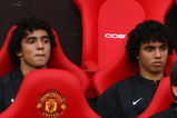 MANCHESTER, UNITED KINGDOM - AUGUST 06:  Rafael Da Silva (L) sits on the bench beside his twin brother and team mate Fabio Da Silva of Manchester United prior to the Pre Season Friendly match between Manchester United and Juventus at Old Trafford on August 6, 2008 in Manchester, England. (Photo by Phil Cole/Getty Images)