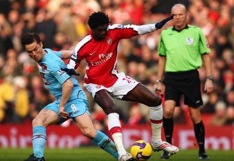 LONDON - JANUARY 31:  Scott Parker of West Ham United challenges Emmanuel Adebayor of Arsenal during the Premier League match between Arsenal and West Ham United at the Emirates Stadium on January 31, 2009 in London, England.  (Photo by Richard Heathcote/Getty Images)