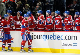 MONTREAL- MARCH 10:  Andrei Kostitsyn #46 and Alex Tanguay #13 of the Montreal Canadiens celebrate the third period goal by Saku Koivu #11 with teammates during the game against the Edmonton Oilers at the Bell Centre on March 10, 2009 in Montreal, Quebec, Canada.  The Canadiens defeated the Oilers 4-3 in overtime.  (Photo by Richard Wolowicz/Getty Images)