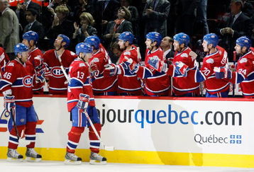 MONTREAL- MARCH 10:  Andrei Kostitsyn #46 and Alex Tanguay #13 of the Montreal Canadiens celebrate the third period goal by Saku Koivu #11 with teammates during the game against the Edmonton Oilers at the Bell Centre on March 10, 2009 in Montreal, Quebec, Canada.  The Canadiens defeated the Oilers 4-3 in overtime.  (Photo by Richard Wolowicz/Getty Images)