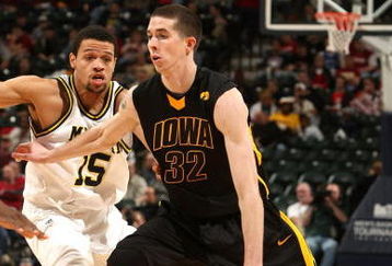 INDIANAPOLIS - MARCH 12:  Jake Kelly #32 of the Iowa Hawkeyes drives against the Michigan Wolveriens during the first round of the Big Ten Men's Basketball Tournament at Conseco Fieldhouse on March 12, 2009 in Indianapolis, Indiana.  (Photo by Jonathan Daniel/Getty Images)