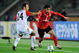 YOKOHAMA, JAPAN - DECEMBER 18:  Sayed Moawad of Al Ahly is challenged by Paul Reid of Adelaide United during FIFA Club World Cup Japan 2008 Fifth Place match between Al Ahly and Adelaide United at the International Stadium on December 18, 2008 in Yokohama, Japan.  (Photo by Shaun Botterill/Getty Images)