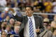 GLENDALE, AZ - MARCH 26:  Head Coach John Calipari of the Memphis Tigers adjusts his team against the Missouri Tigers in the Sweet 16 of the NCAA Division I Men's Basketball Tournament at the University of Phoenix Stadium on March 26, 2009 in Glendale, Arizona.  (Photo by Ronald Martinez/Getty Images)