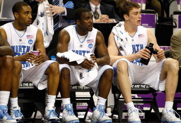 GREENSBORO, NC - MARCH 21:  Wayne Ellington #22, Ty Lawson #5 and Tyler Hansbrough #50 of the North Carolina Tar Heels sit on the bench in the final minutes of their 84-70 win over the Louisiana State University Tigers during the second round of the NCAA Division I Men's Basketball Tournament at the Greensboro Coliseum on March 21, 2009 in Greensboro, North Carolina.  (Photo by Streeter Lecka/Getty Images)