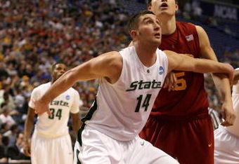 MINNEAPOLIS - MARCH 22:  Goran Suton #14 of the Michigan State Spartans fights for position under the basket against Nikola Vucevic #5 of the USC Trojans during the second round of the NCAA Division I Men's Basketball Tournament at the Hubert H. Humphrey Metrodome on March 22, 2009 in Minneapolis, Minnesota. Michigan State won 74-69. (Photo by Jonathan Daniel/Getty Images)