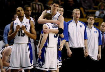BOSTON - MARCH 26:  The Duke Blue Devils sit dejected on their bench after losing to the Villanova Wildcats during the NCAA Men's Basketball Tournament East Regionals at TD Banknorth Garden on March 26, 2009 in Boston, Massachusetts.  (Photo by Elsa/Getty Images)