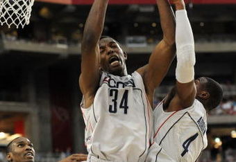 GLENDALE, AZ - MARCH 26:  Center Hasheem Thabeet #34 of the Connenticut Huskies grabs a rebound against the Purdue Boilermakers in the Sweet 16 of the NCAA Division I Men's Basketball Tournament at the University of Phoenix Stadium on March 26, 2009 in Glendale, Arizona.  (Photo by Ronald Martinez/Getty Images)