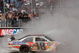 BRISTOL, TN - MARCH 22: Kyle Busch, driver of the #18 Snickers Toyota, does a burnout after winning the NASCAR Sprint Cup Series Food City 500 at Bristol Motor Speedway on March 22, 2009 in Bristol, Tennessee. (Photo by Jerry Markland/Getty Images for NASCAR)