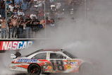 BRISTOL, TN - MARCH 22:  Kyle Busch, driver of the #18 Snickers Toyota, does a burnout after winning the NASCAR Sprint Cup Series Food City 500 at Bristol Motor Speedway on March 22, 2009 in Bristol, Tennessee.  (Photo by Jerry Markland/Getty Images for NASCAR)