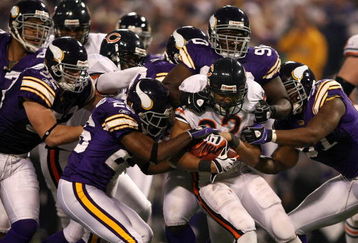 MINNEAPOLIS - NOVEMBER 30:  Matt Forte #22 of the Chicago Bears is stopped by the defense  of the Minnesota Vikings at the Metrodome on November 30, 2008 in Minneapolis, Minnesota.  (Photo by Jonathan Ferrey/Getty Images)