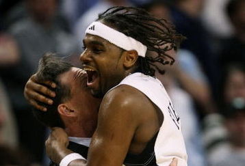 BOSTON - MARCH 26:  Levance Fields #2 of the Pittsburgh Panthers hugs head coach Jamie Dixon after hitting the game-winning shot to beat the Xavier Musketeers during the NCAA Men's Basketball Tournament East Regionals at TD Banknorth Garden on March 26, 2009 in Boston, Massachusetts.  (Photo by Elsa/Getty Images)