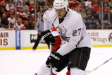 DETROIT - FEBRUARY 07: Dustin Penner #27 of the Edmonton Oilers tries to control the puck during the third period while playing the Detroit Red Wings on February 7, 2009 at Joe Louis Arena in Detroit, Michigan.  (Photo by Gregory Shamus/Getty Images)