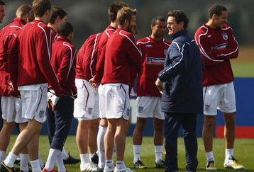 ST ALBANS, ENGLAND - MARCH 24:  England manager Fabio Capello talks with David Beckham during England training at London Colney on March 24, 2009 in St Albans, England.  (Photo by Jamie McDonald/Getty Images)