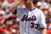 NEW YORK - JULY 10:  John Maine #33 of the New York Mets stands on the mound in the fifth inning against the San Francisco Giants on July 10, 2008 at Shea Stadium in the Flushing neighborhood of the Queens borough of New York City. The Mets defeated the Giants 7-3.  (Photo by Jim McIsaac/Getty Images)