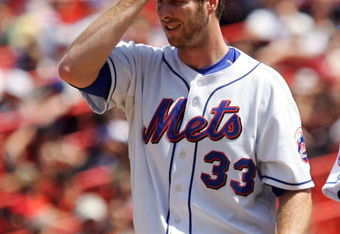 NEW YORK - JULY 10:  John Maine #33 of the New York Mets stands on the mound in the fifth inning against the San Francisco Giants on July 10, 2008 at Shea Stadium in the Flushing neighborhood of the Queens borough of New York City. The Mets defeated the Giants 7-3.  (Photo by Jim McIsaac/Getty Images)