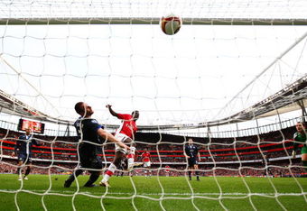 LONDON - MARCH 14:   Emmanuel Eboue of Arsenal scores their third goal during the Barclays Premier League match between Arsenal and Blackburn Rovers at Emirates Stadium on March 14, 2009 in London, England.  (Photo by Clive Mason/Getty Images)