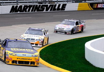MARTINSVILLE, VA - MARCH 27:  Jamie McMurray, driver of the #26 IRWIN Industrial Tools Ford, leads Reed Sorenson, driver of the Charter Communication Dodge, and Scott Speed, driver of the #82 Red Bull Toyota, during practice for the NASCAR Sprint Cup Series Goody�s Fast Pain Relief 500 at the Martinsville Speedway on March 27, 2009 in Martinsville, Virginia.  (Photo by Rusty Jarrett/Getty Images)