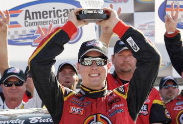 HAMPTON, GA - MARCH 07:  Kyle Busch driver of the #51 Miccosukee Resort Toyota celebrates in Victory Lane with his team after the NASCAR Craftsman Truck Series American Commercial Lines 200 at the Atlanta Motor Speedway on March 7, 2009 in Hampton, Georgia.  (Photo by John Harrelson/Getty Images)