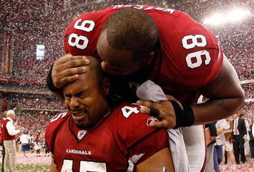 GLENDALE, AZ - JANUARY 18:  Fullback Terrelle Smith #45 and tackle Gabe Watson #98 of the Arizona Cardinals celebrate after the NFC championship game against the Philadelphia Eagles on January 18, 2009 at University of Phoenix Stadium in Glendale, Arizona. The Cardinals defeated the Eagles 32-25 to advance to the Super Bowl.  (Photo by Chris Graythen/Getty Images)