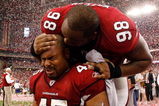 GLENDALE, AZ - JANUARY 18:  Fullback Terrelle Smith #45 and tackle Gabe Watson #98 of the Arizona Cardinals celebrate after the NFC championship game against the Philadelphia Eagles on January 18, 2009 at University of Phoenix Stadium in Glendale, Arizona. The Cardinals defeated the Eagles 32-25 to advance to the Super Bowl.  (Photo by Chris Graythen/Getty Images)