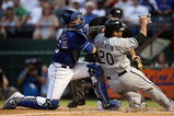 ARLINGTON, TX - JULY 11:  Catcher Jarrod Saltalamacchia #25 of the Texas Rangers makes the out against Carlos Quentin #20 of the Chicago White Sox in the 4th inning on July 11, 2008 at Rangers Ballpark in Arlington, Texas.  (Photo by Ronald Martinez/Getty Images)