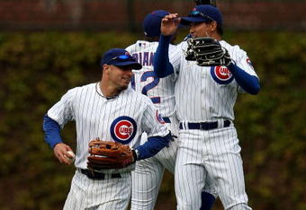 CHICAGO - MAY 10: (L-R) Reed Johnson #9, Alfonso Soriano #12 and Kosuke Fukudome #1 of the Chicago Cubs celebrate a win over the Arizona Diamondbacks on May 10, 2008 at Wrigley Field in Chicago, Illinois. The Cubs defeated the Diamondbacks 7-2. (Photo by Jonathan Daniel/Getty Images)