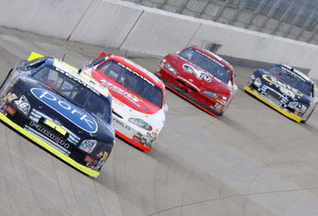 NASHVILLE, TN - AUGUST 12:  Frank Kimmel, driver of the #46 Pork The Other White Meat-Mighty EZY Ford, leads a group of cars during the ARCA RE/MAX 200 on August 12, 2006 at the Nashville Superspeedway in Nashville, Tennessee.  (Photo by Chris Graythen/Getty Images for NASCAR)