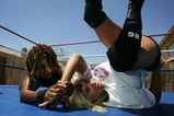 VICTORVILLE, CA - MAY 06:  Cuban-born professional wrestler Hurricane Havana (R) and Vash Johnson train on her backyard wresting ring on May 6, 2006 in the desert town of Victorville, California.  Born in the small town of Guanavacoa, Cuba, Hurricane immigrated to the US as a child in the 1970?s when Cuban leader Fidel Castro released prisoners, including her parents who were political prisoners, to the US. First settling in Miami, Florida. The family later moved to southern California where at the age of 16 she held three jobs at once to help support her large family. At 19 she married and after having two children, began modeling until a small wrestling company surprised her by asking if she would be interested in pro-style wrestling. She fell in love with the rough and tumble life style and today works as a wrestler at Lucha Libre shows and a number of other wresting venues in the U.S. and Mexico. Because she found few other female opponents, she has begun training women to wrestle against.     (Photo by D