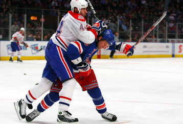 NEW YORK - JANUARY 7:  Roman Hamrlik #44 of the Montreal Canadiens and Colton Orr #28 of the New York Rangers fight for position at Madison Square Garden January 7, 2009 in New York City. The Canadiens defeated the Rangers 6-3.  (Photo by Mike Stobe/Getty Images)